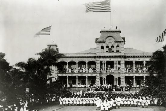 Iolani Palace in Honolulu, Hawaii, was the residence of the Hawaiian monarchs. It is shown here with an American flag raised above it.